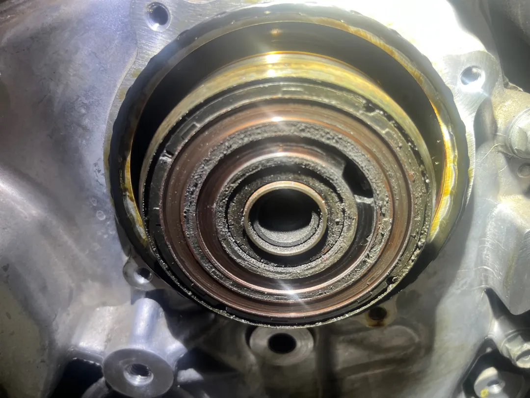 Close detail of a camshaft position actuator seated in an engine cylinder head