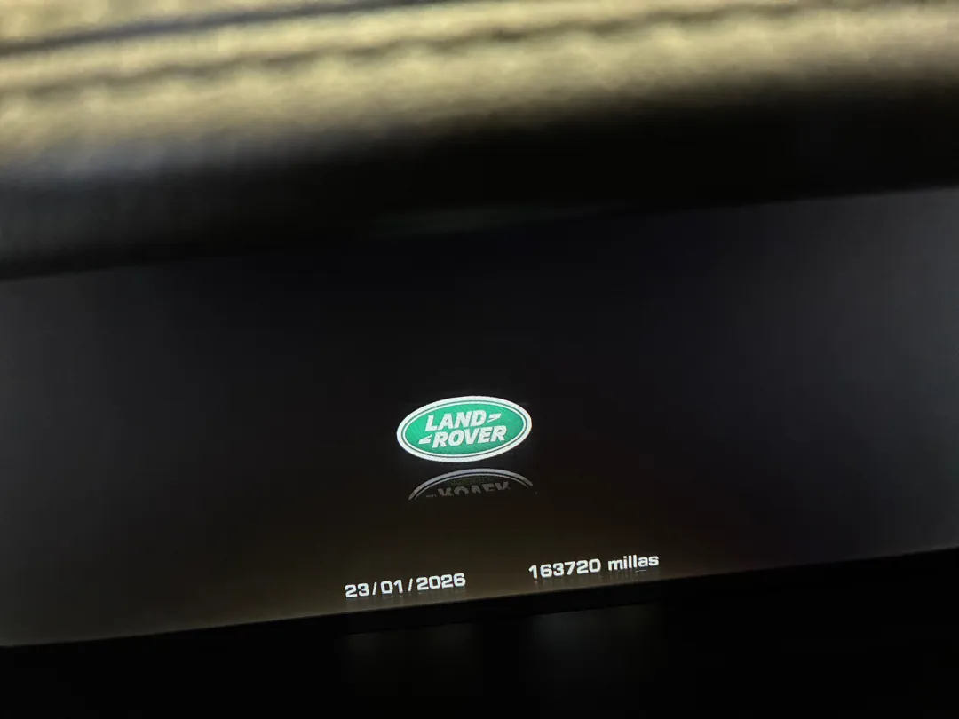 Vehicle infotainment screen showing a service record with a date and an odometer reading