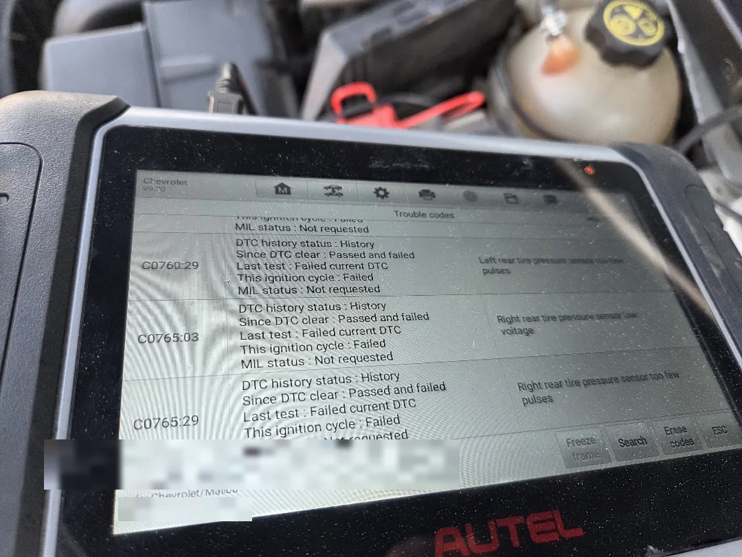 Scan tool screen listing tire pressure sensor faults for individual wheel positions